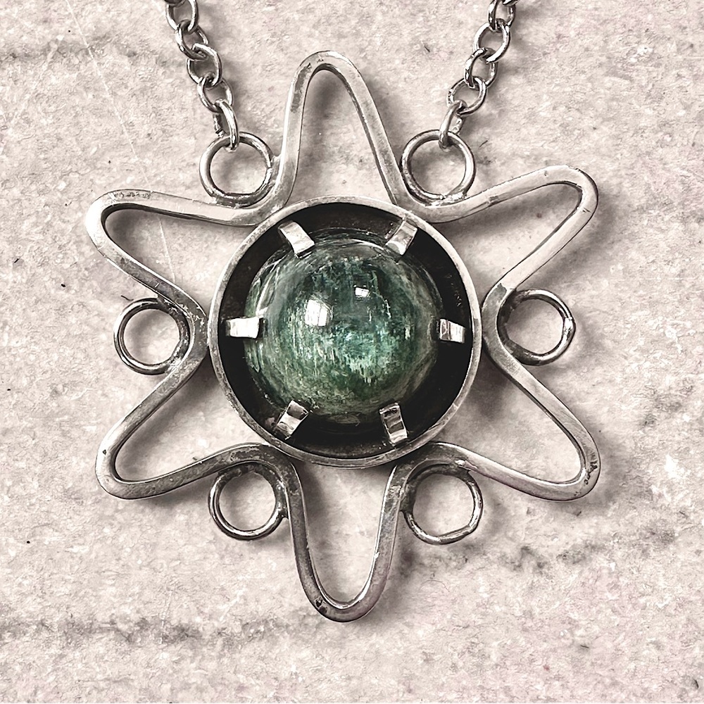 Artisan made sterling silver star and green stone necklace.